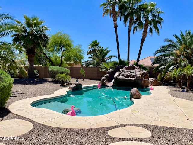 view of swimming pool with a patio area