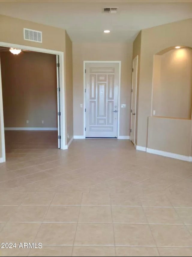 empty room with light tile floors