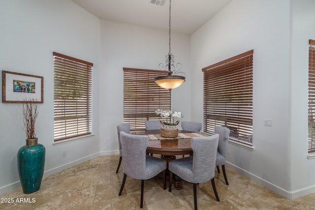 dining room featuring visible vents and baseboards