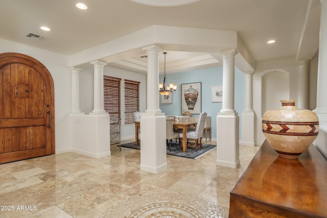 entrance foyer with baseboards, recessed lighting, visible vents, and ornate columns