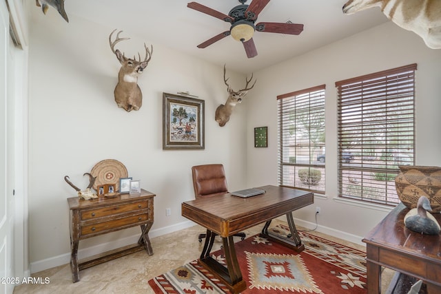 office with a ceiling fan and baseboards