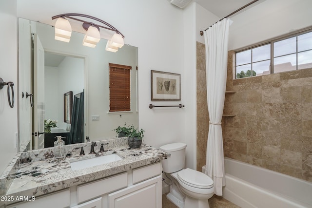 bathroom featuring toilet, shower / tub combo with curtain, and vanity