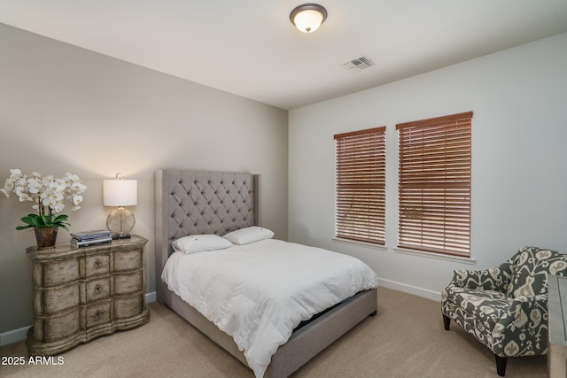 bedroom featuring carpet flooring, visible vents, and baseboards