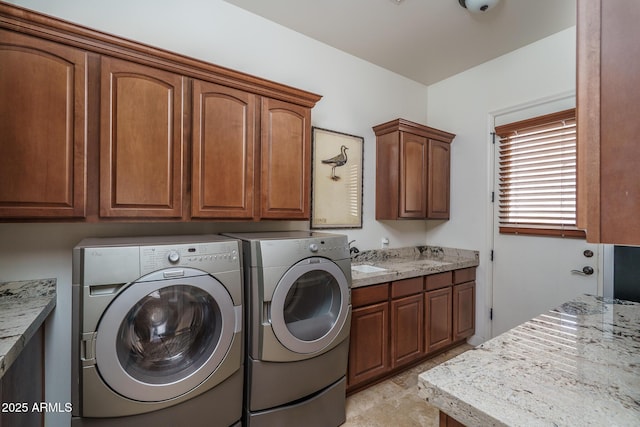 washroom with cabinet space and washing machine and clothes dryer