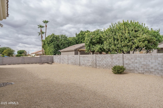 view of yard with a fenced backyard