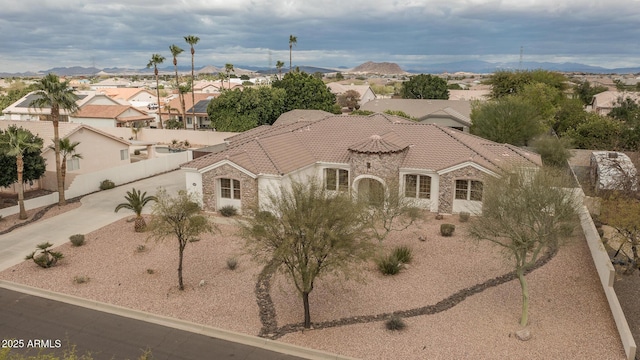 birds eye view of property with a residential view