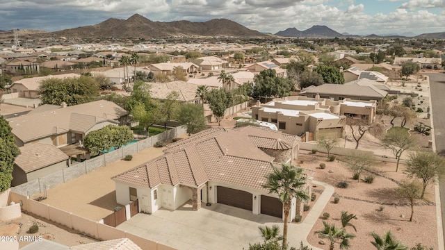 drone / aerial view with a residential view and a mountain view