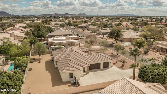 birds eye view of property with a residential view and a mountain view