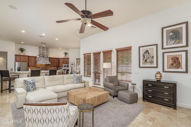 living area with ceiling fan, baseboards, visible vents, and recessed lighting