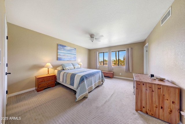 2524 S El Paradiso Dr Unit 82, Mesa, AZ 85202 - bedroom featuring light carpet, baseboards, and ceiling fan