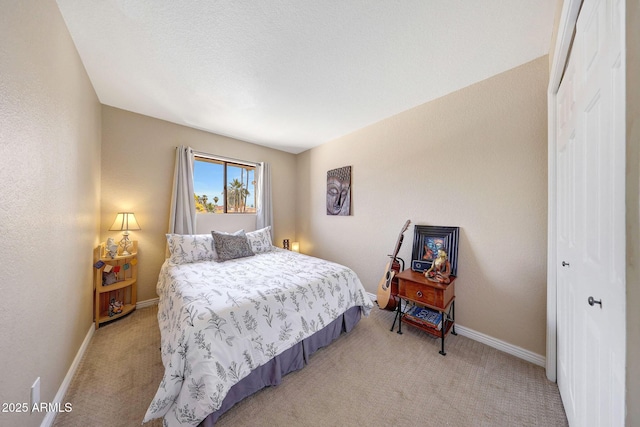 2524 S El Paradiso Dr Unit 82, Mesa, AZ 85202 - bedroom with light carpet, a closet, and baseboards