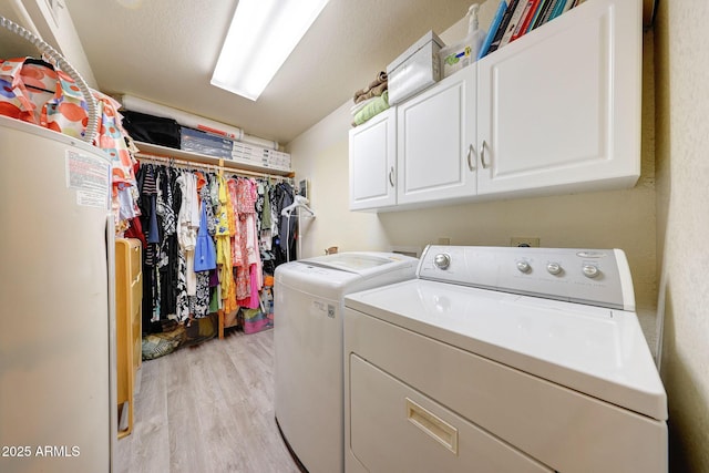 2524 S El Paradiso Dr Unit 82, Mesa, AZ 85202 - laundry area with separate washer and dryer, cabinet space, and light wood-style flooring