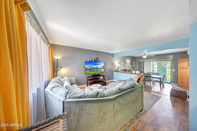 2524 S El Paradiso Dr Unit 82, Mesa, AZ 85202 - living area featuring wood finished floors, ceiling fan, a textured ceiling, and baseboards