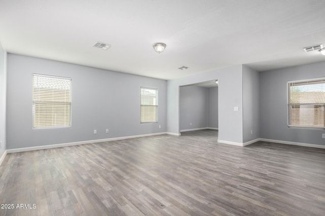 unfurnished room featuring hardwood / wood-style floors