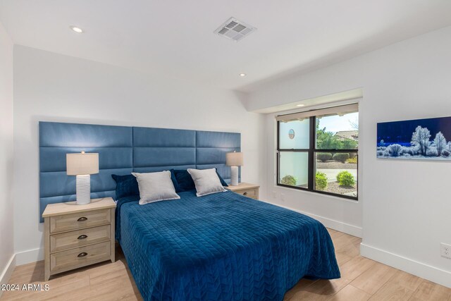 bedroom with light wood-type flooring