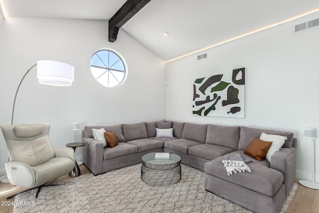 living room with lofted ceiling with beams and wood-type flooring