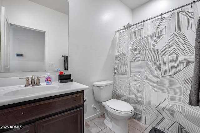 bathroom with toilet, a shower with shower curtain, vanity, and tile patterned floors