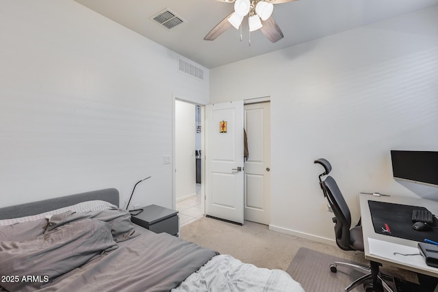 bedroom featuring ceiling fan and light colored carpet