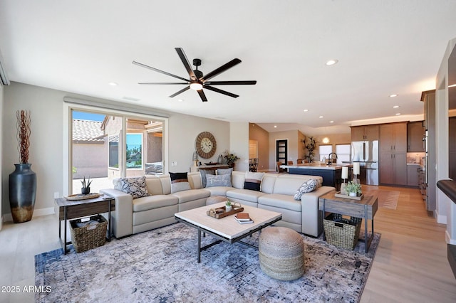 19745 N Mountain Sage Ln, Surprise, AZ 85374 - living room featuring light wood finished floors, ceiling fan, and recessed lighting