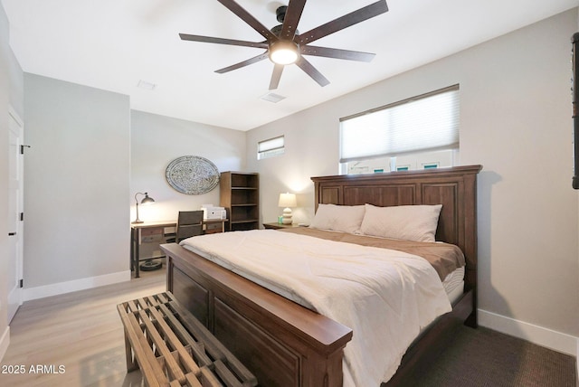 19745 N Mountain Sage Ln, Surprise, AZ 85374 - bedroom with light wood-style flooring and ceiling fan