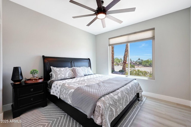 19745 N Mountain Sage Ln, Surprise, AZ 85374 - bedroom featuring light wood-style flooring and a ceiling fan