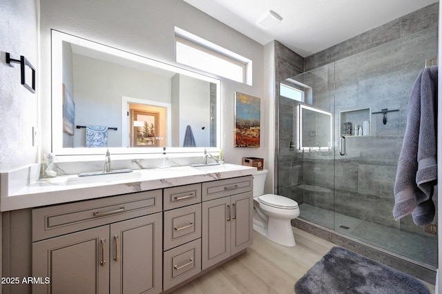 19745 N Mountain Sage Ln, Surprise, AZ 85374 - bathroom featuring double vanity, a shower stall, and wood finished floors