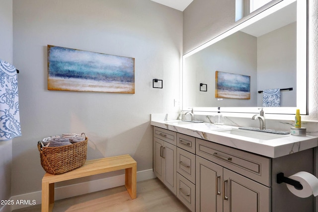 19745 N Mountain Sage Ln, Surprise, AZ 85374 - bathroom featuring double vanity and wood finished floors