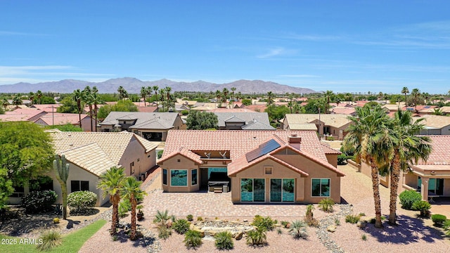 19745 N Mountain Sage Ln, Surprise, AZ 85374 - mediterranean / spanish house featuring a residential view, stucco siding, and a mountain view