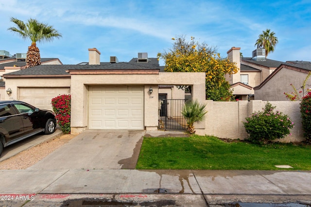 view of front facade with a garage and a front yard