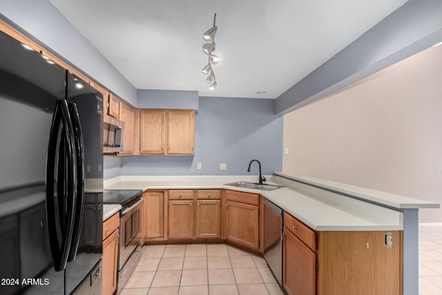 kitchen with kitchen peninsula, appliances with stainless steel finishes, light tile patterned floors, and sink