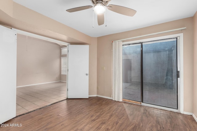 unfurnished room featuring ceiling fan and wood-type flooring