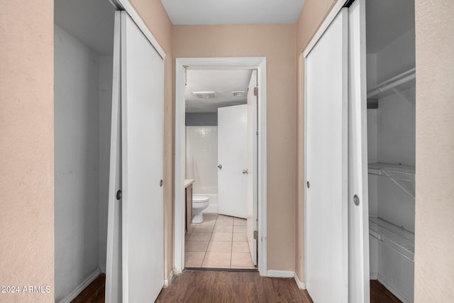 hallway with light wood-type flooring