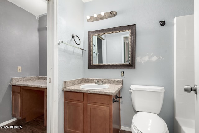 bathroom with vanity, wood-type flooring, and toilet