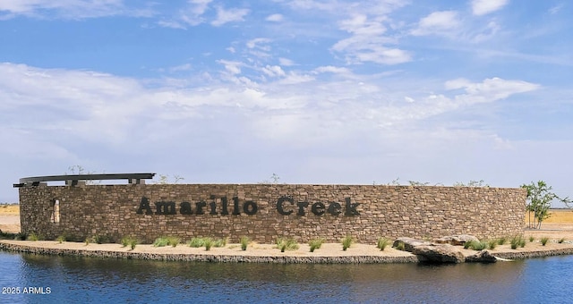 community sign with a water view