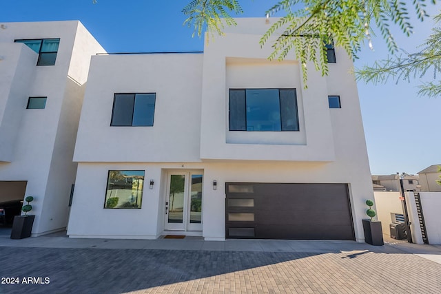 2130 E Turney Ave Unit 4, Phoenix, AZ 85016 - modern home with an attached garage, stucco siding, and decorative driveway