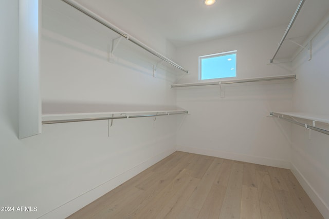 walk in closet featuring light wood-type flooring