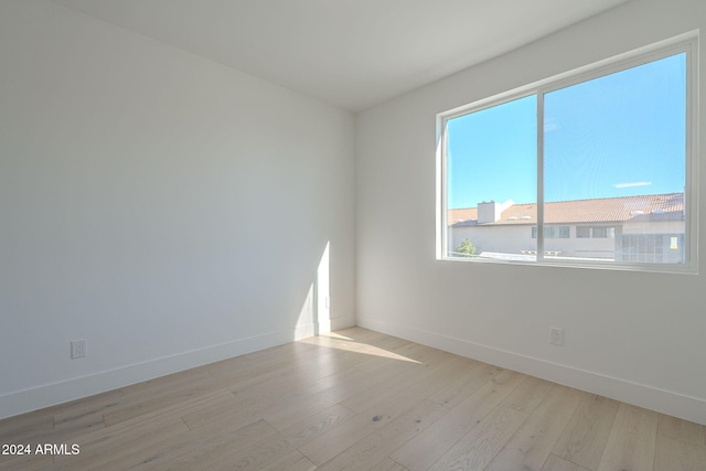 empty room with light hardwood / wood-style floors