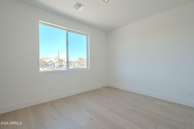 empty room with light hardwood / wood-style floors