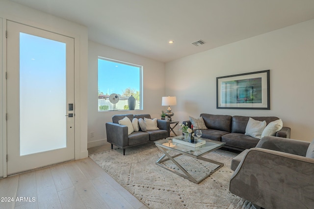 living room with light hardwood / wood-style floors