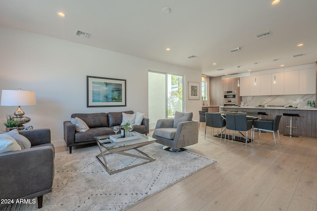 living room with light hardwood / wood-style flooring