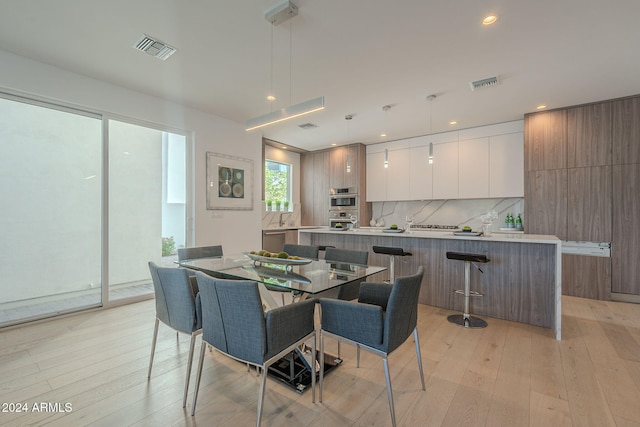 dining area featuring light hardwood / wood-style flooring