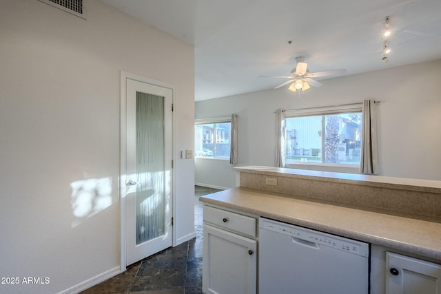 kitchen with dishwasher, ceiling fan, white cabinetry, and a wealth of natural light