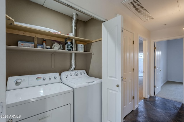 laundry area with separate washer and dryer