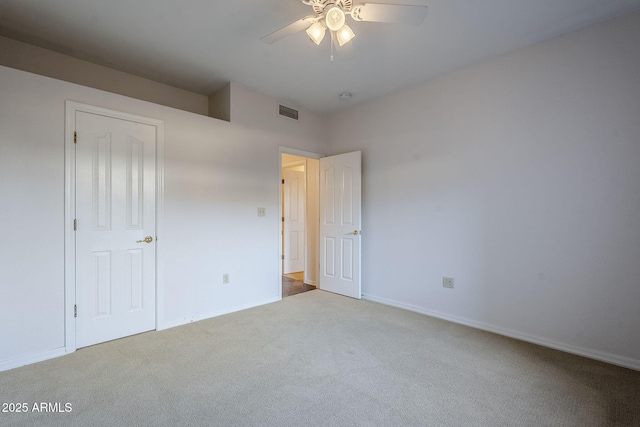 unfurnished bedroom with carpet flooring and ceiling fan