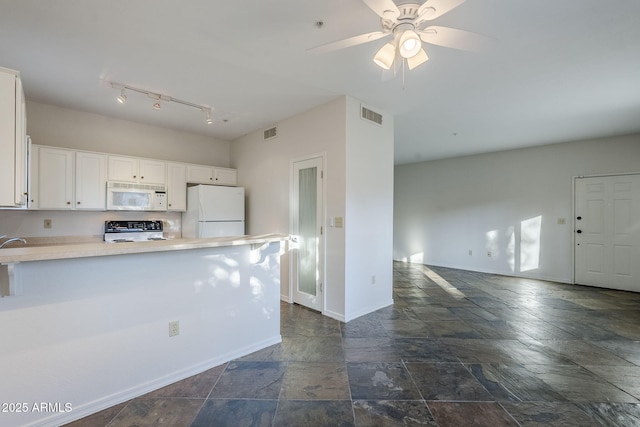 kitchen featuring kitchen peninsula, white appliances, white cabinetry, and ceiling fan