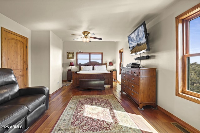 bedroom featuring dark hardwood / wood-style floors and ceiling fan