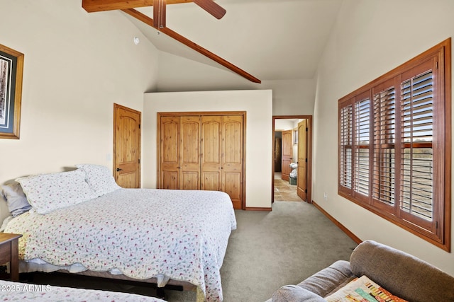 bedroom featuring high vaulted ceiling, light carpet, ceiling fan, and a closet