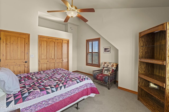 bedroom with lofted ceiling, light colored carpet, ceiling fan, and a closet