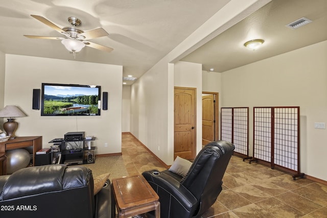 cinema room featuring ceiling fan