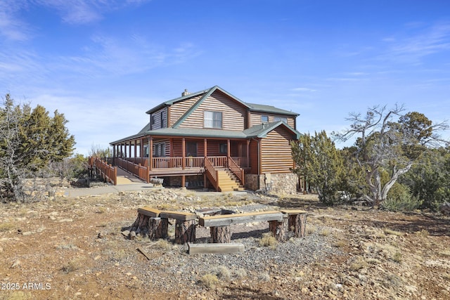 back of house featuring covered porch